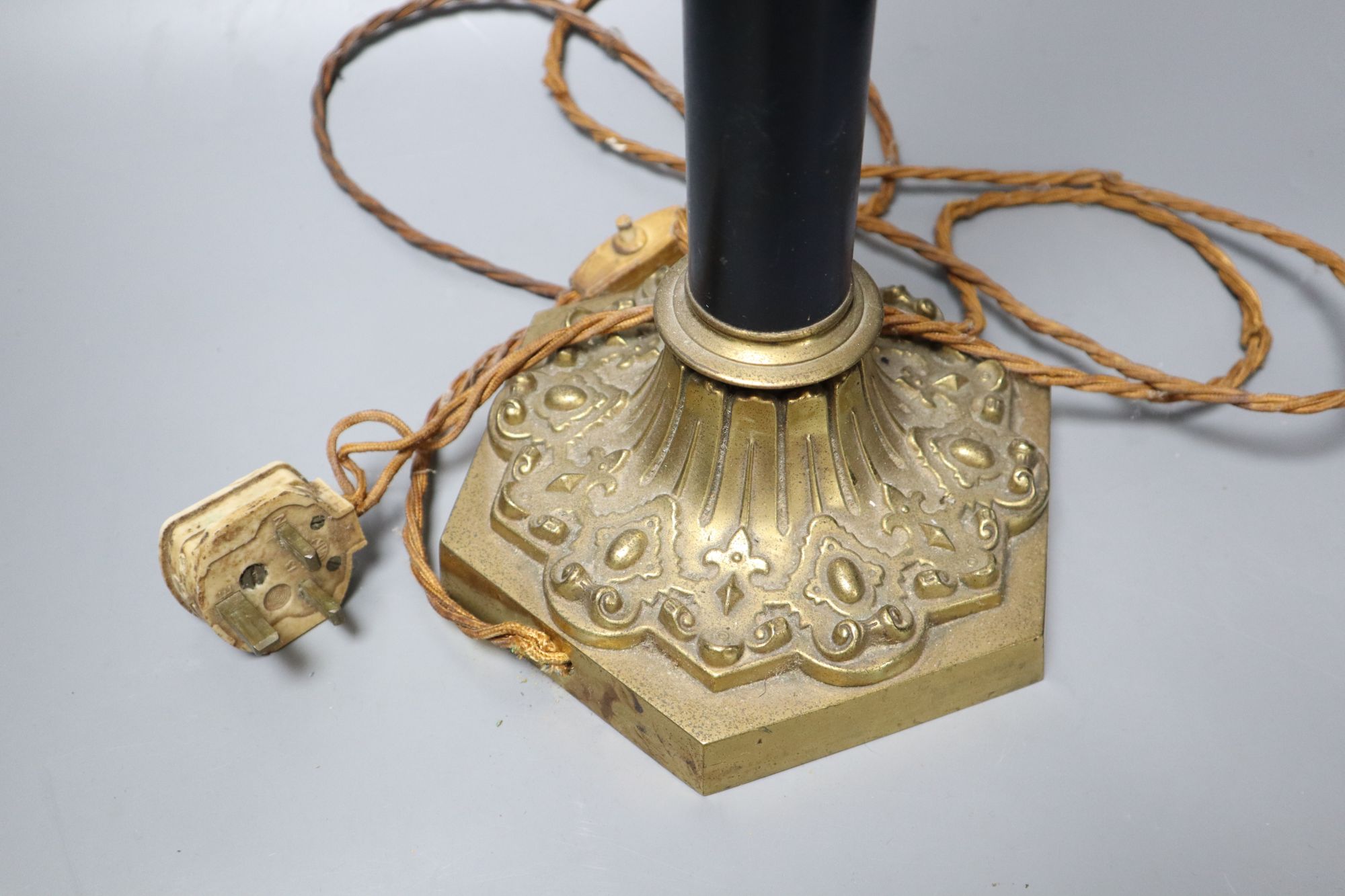 A brass and ebonised patented table lamp